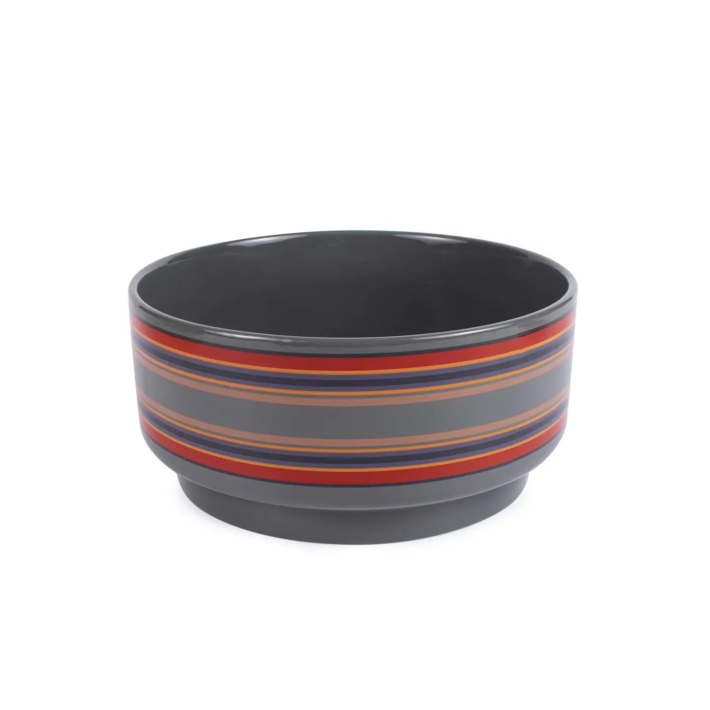 Gray dog bowl with red and blue stripes on a white background. Wagging Tails Pet Boutique
